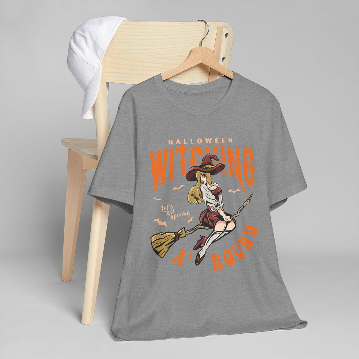 Witching Around Halloween T‑Shirt — Vintage Pinup Witch on Broom